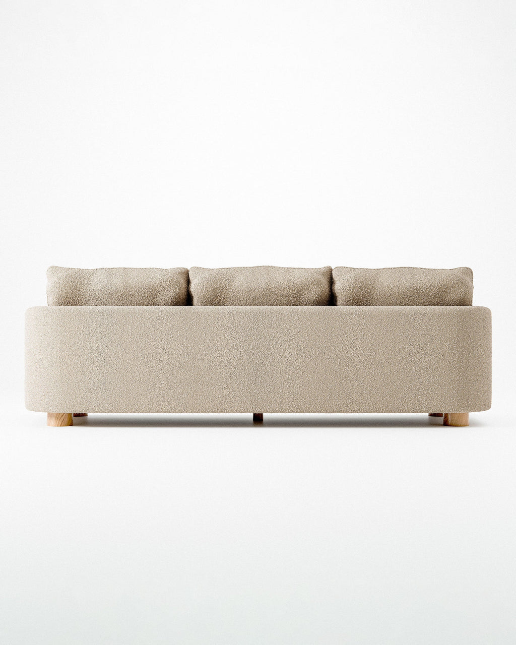 Miles treseters sofa i beige bouclé med sylindriske eikeben